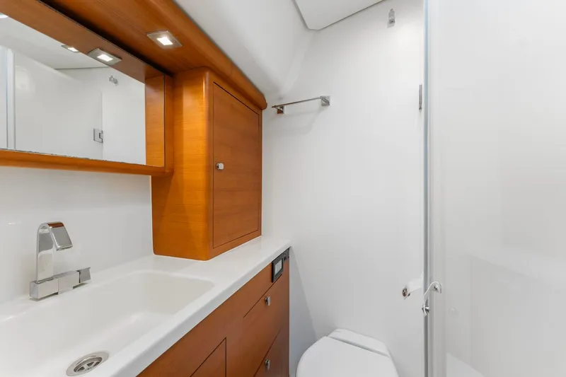 Slide: The Image of Luxurious 2015 Italia Yachts 13.98 bathroom with sleek wood cabinetry and modern fixtures. - 38