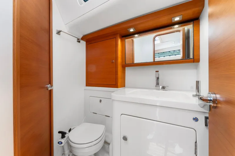 Slide: The Image of Luxurious bathroom in 2015 Italia Yachts 13.98, featuring modern fixtures and wooden accents. - 41