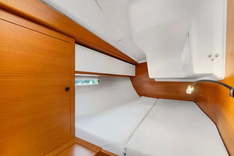 Slide: The Image of Luxurious cabin interior of 2015 Italia Yachts 13.98 with wooden finish and cozy bedding. - 42