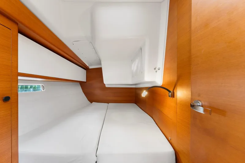 Slide: The Image of Luxurious cabin interior of 2015 Italia Yachts 13.98 with wooden finish and cozy bedding. - 43