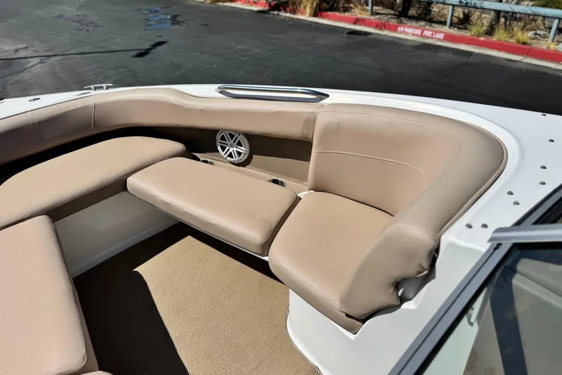 Slide: The Image of 2008 Cobalt 262 boat interior with beige seating and speaker detail. - 13