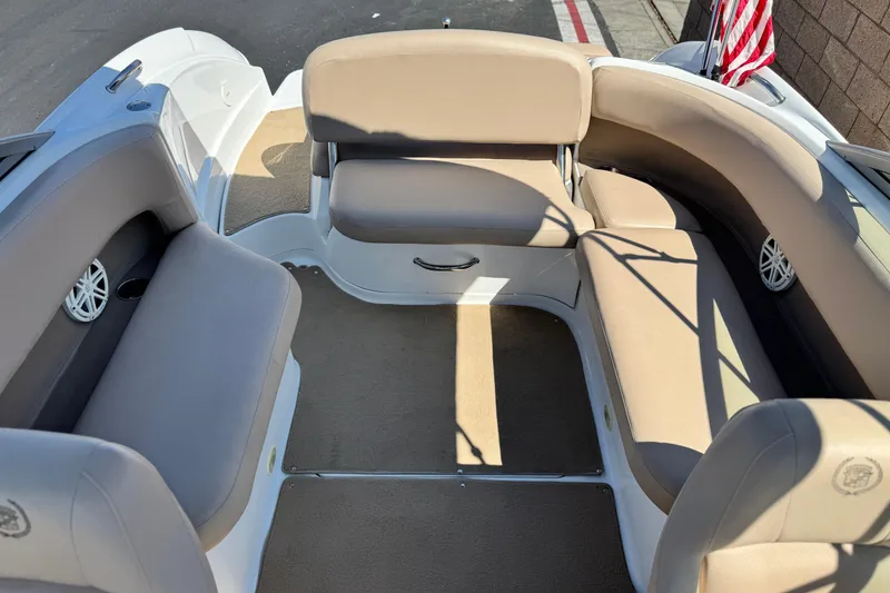 Slide: The Image of Interior of a 2008 Cobalt 262 boat with beige seating and American flag. - 17
