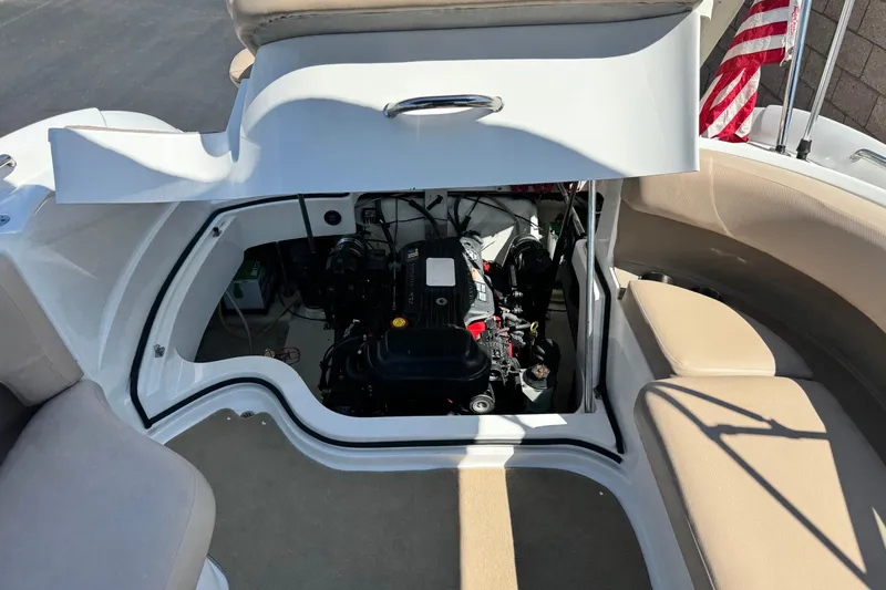 Slide: The Image of Open engine compartment of a 2008 Cobalt 262 boat, showcasing interior mechanics. - 19