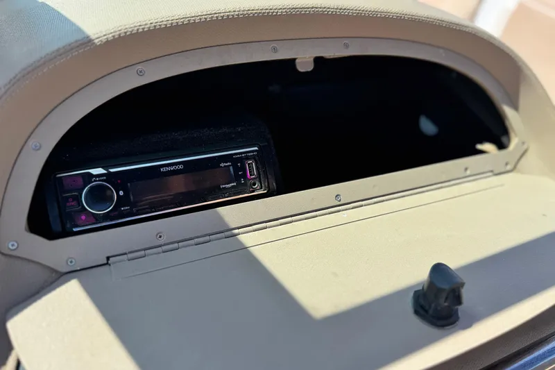 Slide: The Image of Kenwood stereo system in a 2008 Cobalt 262 boat dashboard compartment. - 23