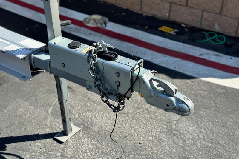 Slide: The Image of Trailer hitch of a 2008 Cobalt 262 boat, secured with a chain. - 29