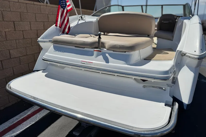 Slide: The Image of 2008 Cobalt 262 boat with American flag, rear view showing seating and swim platform. - 6
