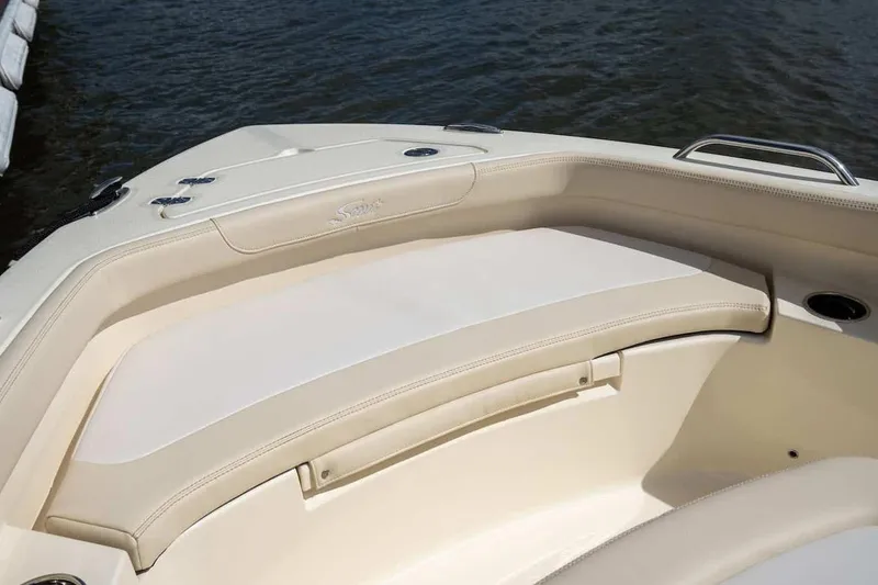 Slide: The Image of Manufacturer Provided Image: 2026 Scout 188 Sportfish boat interior with beige seating, near water. - 3