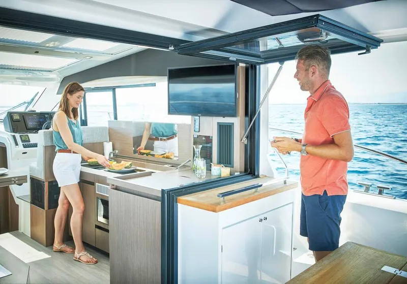 Slide: The Image of Couple enjoying the modern interior of a 2026 Sealine C390 yacht. - 21