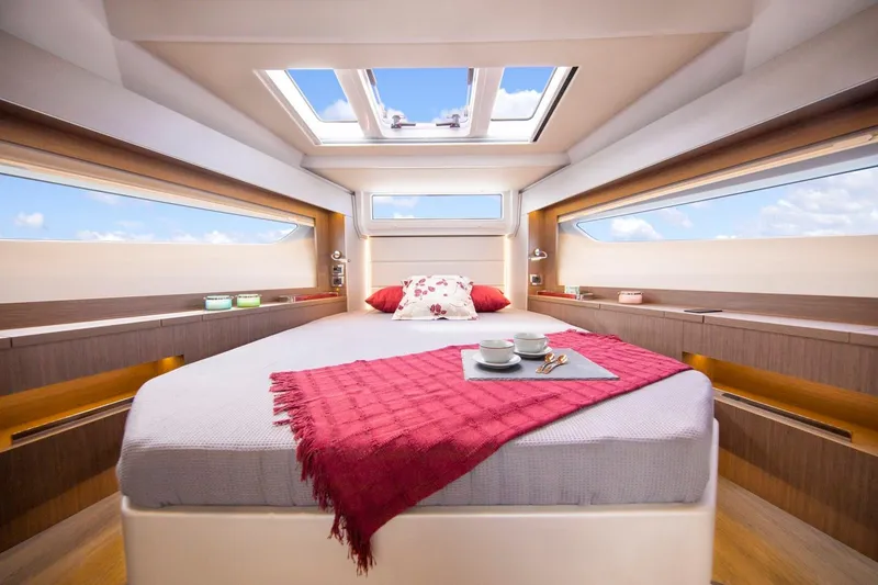 Slide: The Image of Luxurious interior of 2026 Sealine C390 yacht with skylight and cozy bed. - 25