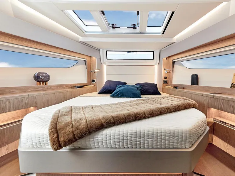 Slide: The Image of Luxurious interior of 2026 Sealine C390 yacht with skylight and cozy bedding. - 28