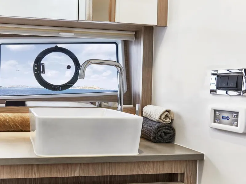 Slide: The Image of Modern bathroom interior of 2026 Sealine C390 yacht with sleek sink and ocean view. - 31