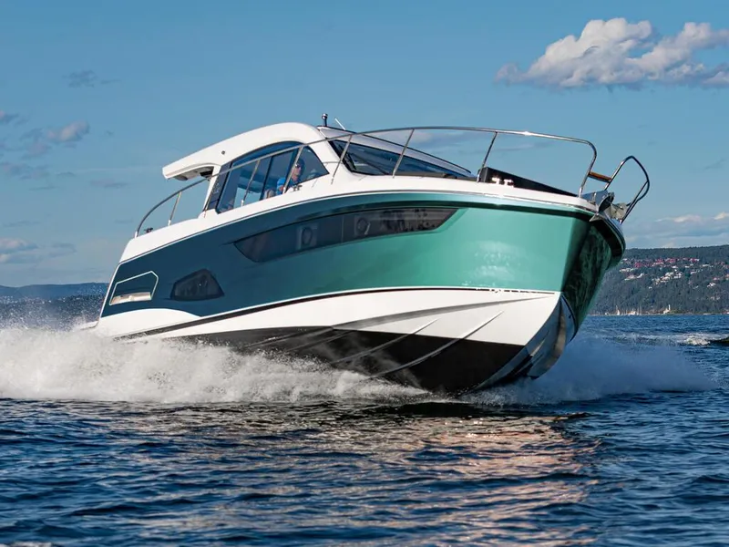 Slide: The Image of 2026 Sealine C390 yacht cruising on open water under a clear blue sky. - 8