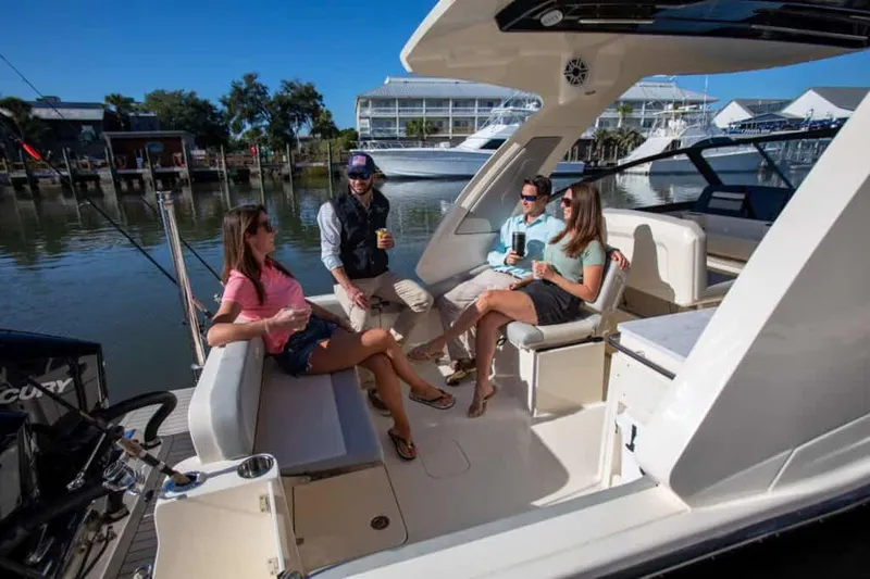 Slide: The Image of Manufacturer Provided Image: 2025 Scout 277 Dorado boat with people enjoying a sunny day on the water. - 3
