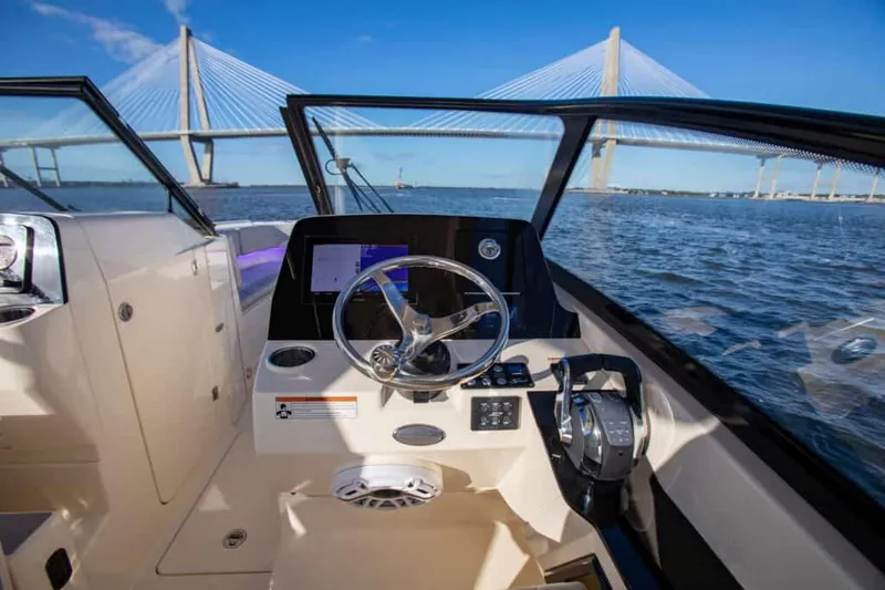 Slide: The Image of Manufacturer Provided Image: 2025 Scout 277 Dorado boat interior with bridge view on the water. - 7