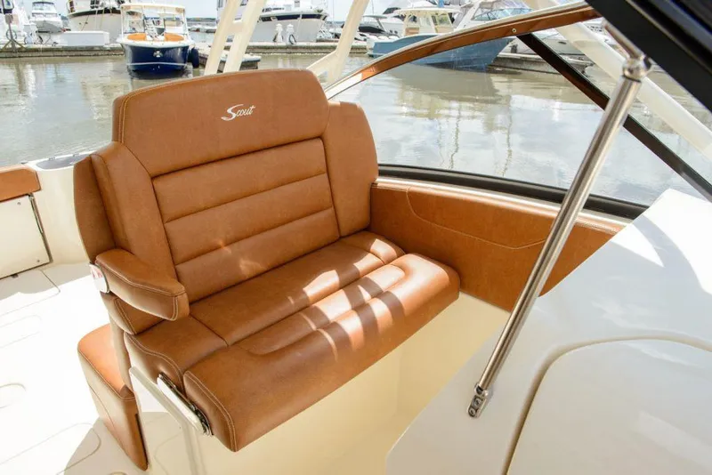 Slide: The Image of Manufacturer Provided Image: Luxurious seating on 2025 Scout 255 Dorado boat, docked at marina. - 9