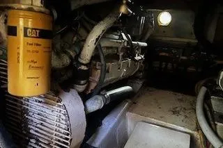 Slide: The Image of Engine room of 1990 Hatteras 40 Motor Yacht with visible CAT fuel filter. - 17