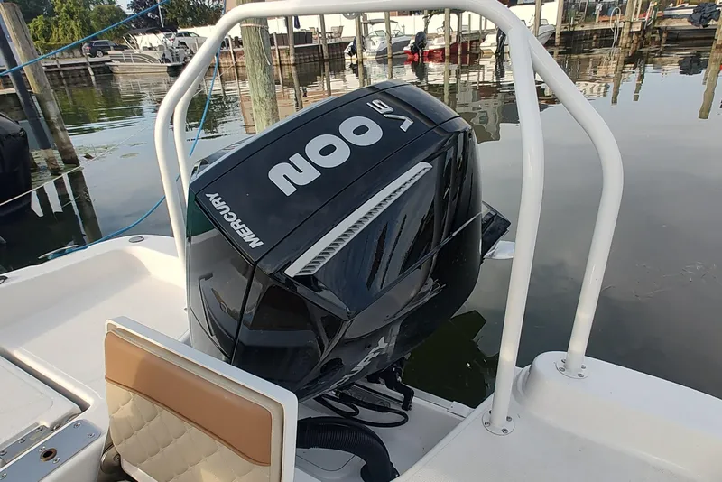 Slide: The Image of 2026 NauticStar 231 Hybrid boat with Mercury 400 outboard engine at dock. - 9