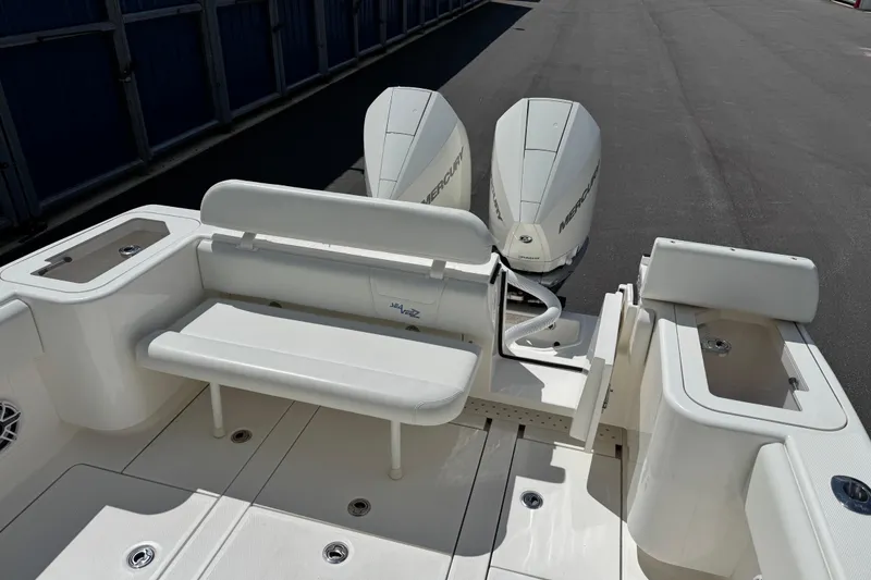 Slide: The Image of 2024 SeaVee 32Z boat with dual Mercury engines and spacious seating area. - 14