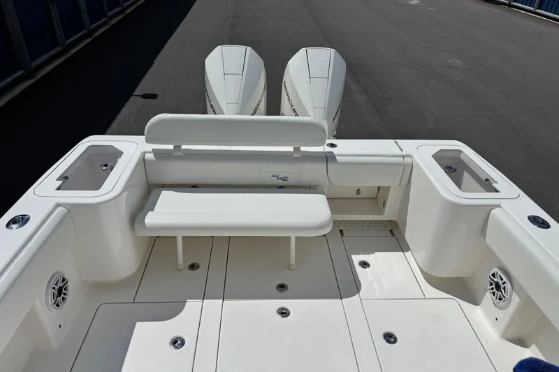 Slide: The Image of 2024 SeaVee 32Z boat deck with seating and twin outboard engines. - 15