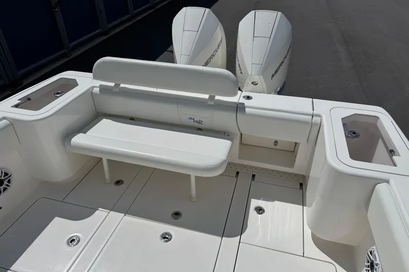 Slide: The Image of 2024 SeaVee 32Z boat interior with seating and dual Mercury outboard engines. - 16