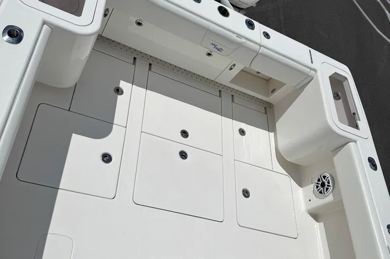 Slide: The Image of 2024 SeaVee 32Z boat deck with storage compartments and speaker. - 18