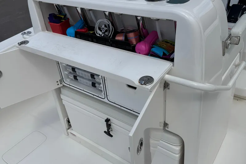 Slide: The Image of 2024 SeaVee 32Z boat storage compartment with organized fishing gear and tackle boxes. - 20