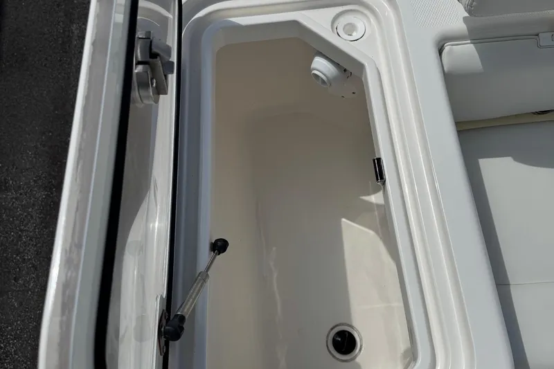 Slide: The Image of 2024 SeaVee 32Z boat storage compartment with open lid, showcasing interior details. - 26