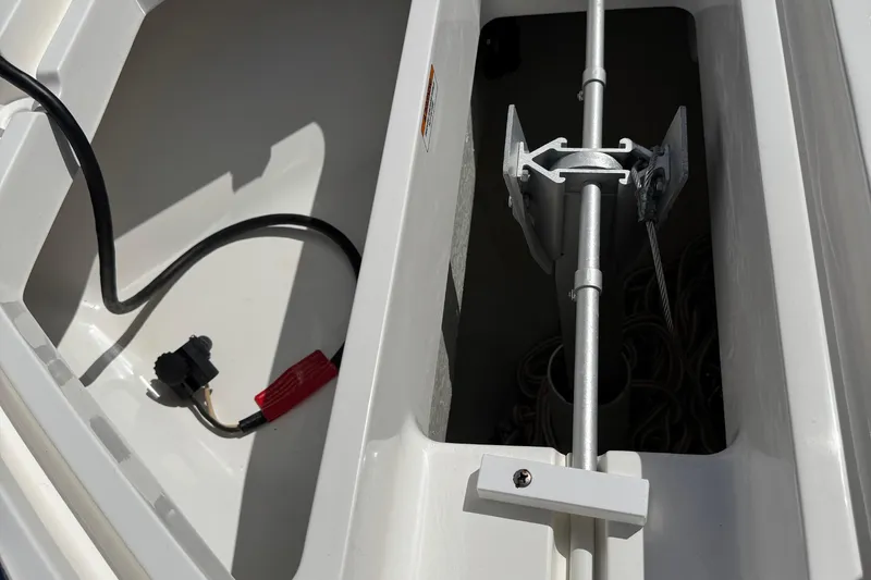 Slide: The Image of 2024 SeaVee 32Z boat anchor compartment with wiring and metal components. - 29