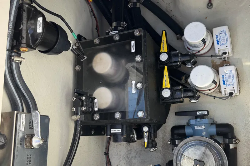 Slide: The Image of 2024 SeaVee 32Z boat engine compartment with pumps and valves. - 35