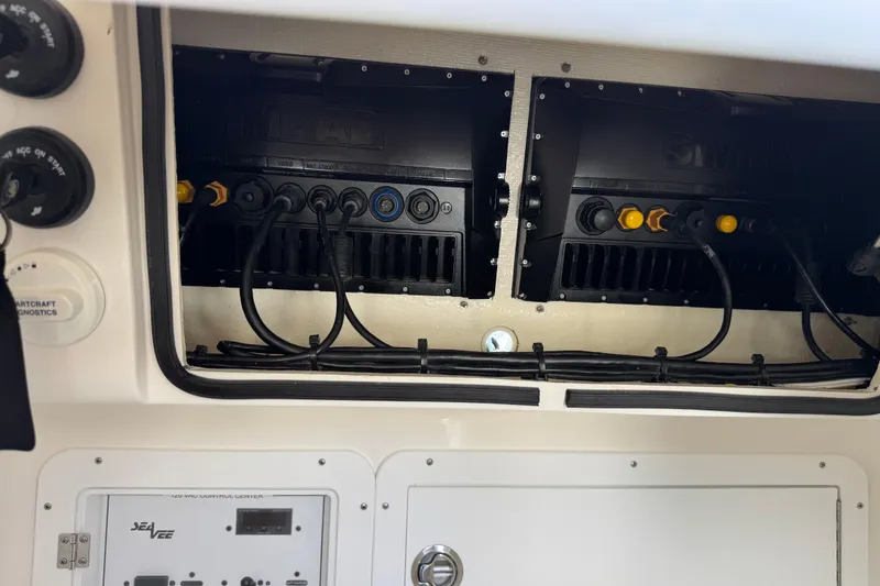 Slide: The Image of 2024 SeaVee 32Z boat electronics panel with wiring and diagnostic controls. - 38