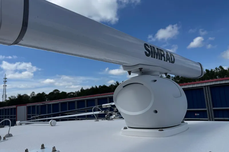 Slide: The Image of Simrad radar on 2024 SeaVee 32Z boat under blue sky. - 39