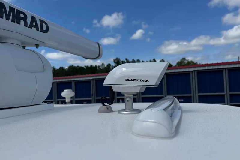 Slide: The Image of 2024 SeaVee 32Z boat radar and antenna under blue sky. - 40