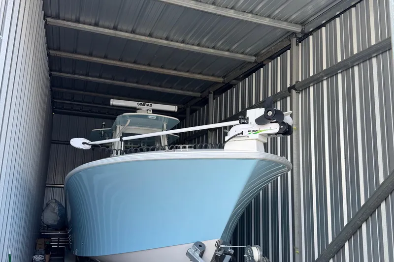 Slide: The Image of 2024 SeaVee 32Z boat stored in a metal shed, featuring advanced navigation equipment. - 8