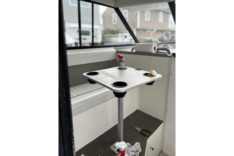 Slide: The Image of 1994 Bayliner 2859 Classic Cruiser interior with table and seating area. - 4