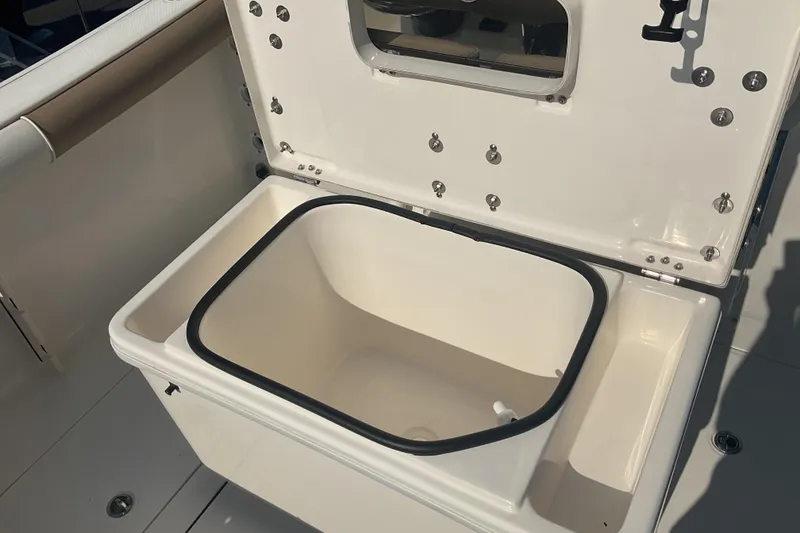 Slide: The Image of 2023 Sea Born SX239 Offshore boat storage compartment open, showcasing interior space. - 25