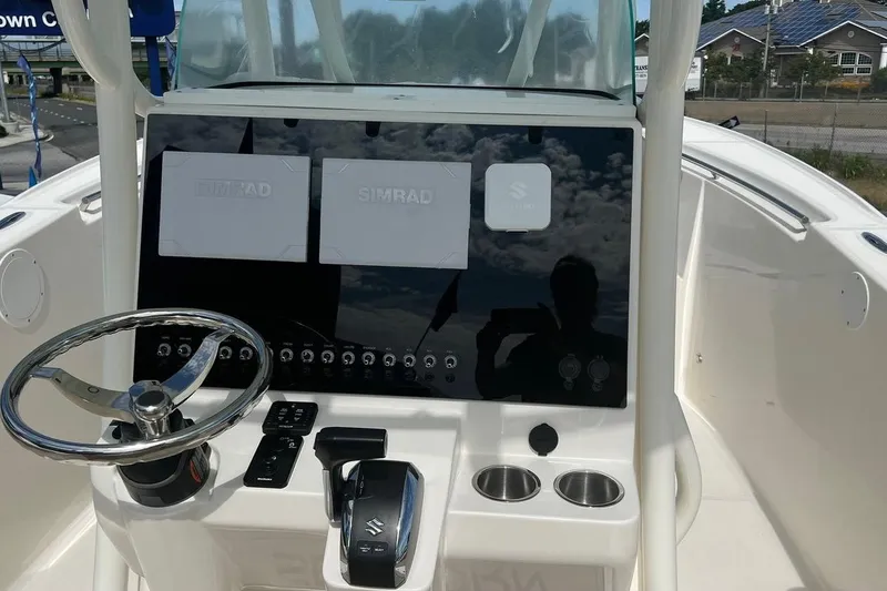 Slide: The Image of 2023 Sea Born SX239 Offshore boat with powerful 300 HP engine displayed outdoors. - 3