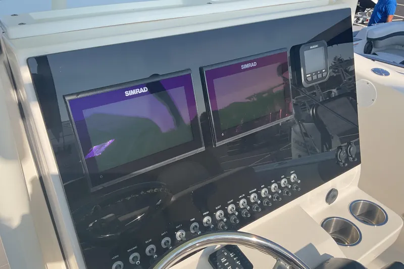 Slide: The Image of Control panel of 2023 Sea Born SX239 Offshore boat with Simrad displays. - 30