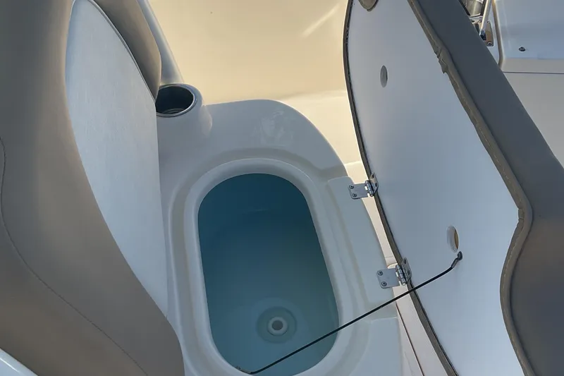Slide: The Image of 2023 Sea Born SX239 Offshore boat interior with open storage compartment. - 32