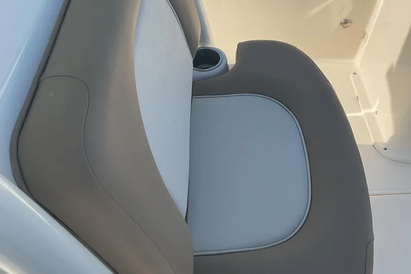 Slide: The Image of 2023 Sea Born SX239 Offshore boat seat with cup holder, featuring gray and white upholstery. - 33