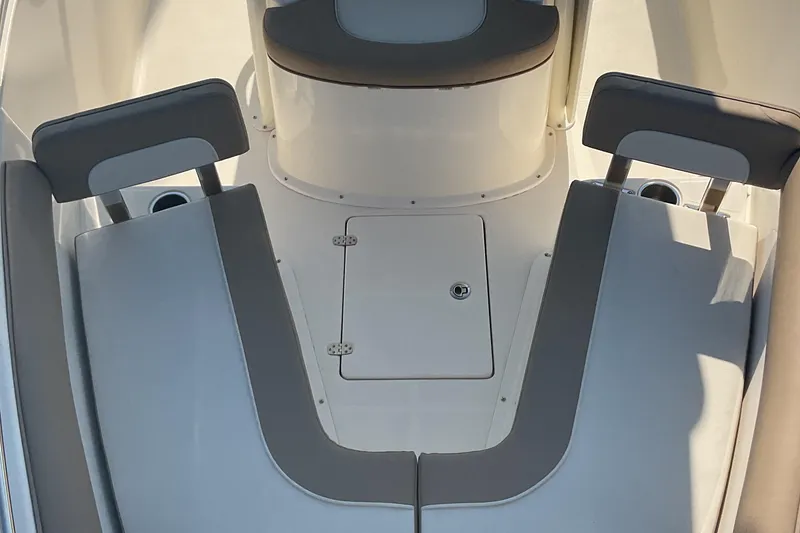 Slide: The Image of 2023 Sea Born SX239 Offshore boat interior with cushioned seating and storage compartment. - 36