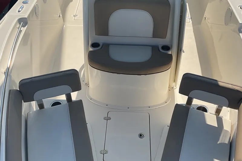 Slide: The Image of 2023 Sea Born SX239 Offshore boat interior with seating and cup holders. - 37