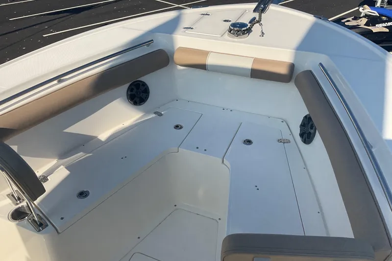 Slide: The Image of 2023 Sea Born SX239 Offshore boat interior with cushioned seating and speakers. - 38