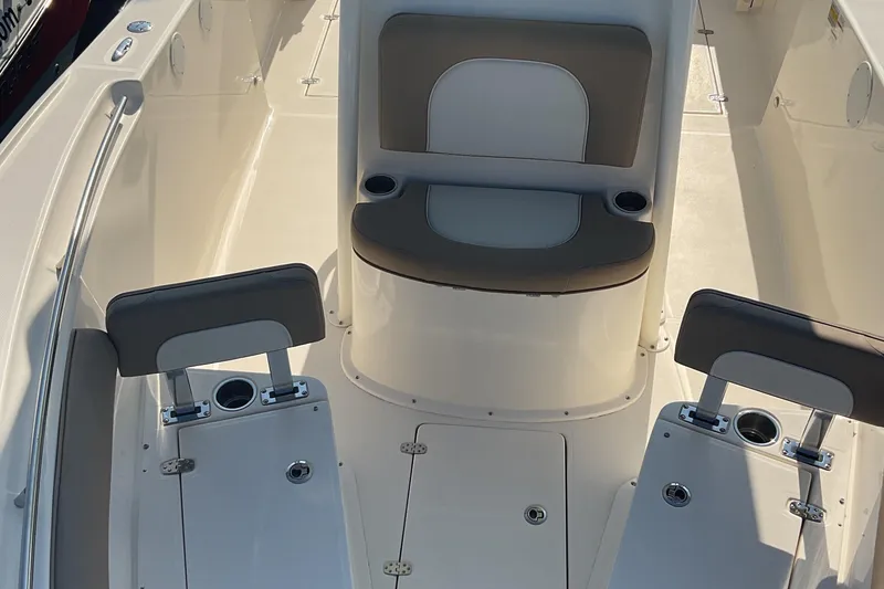 Slide: The Image of 2023 Sea Born SX239 Offshore boat interior with seating and cup holders. - 41