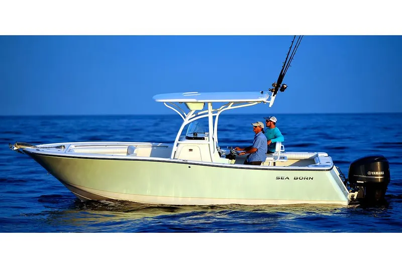 Slide: The Image of 2023 Sea Born SX239 Offshore boat interior with beige seating and control panel. - 6