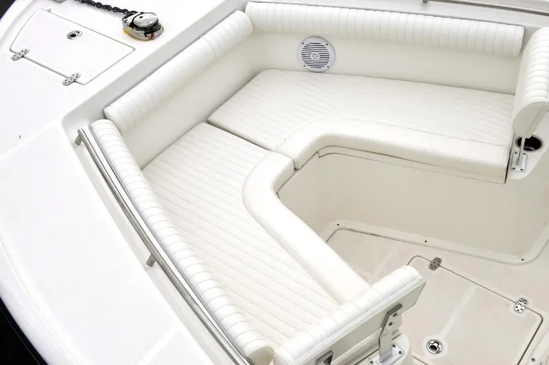 Slide: The Image of 2023 Sea Born SX239 Offshore boat seating with storage and cup holders. - 7