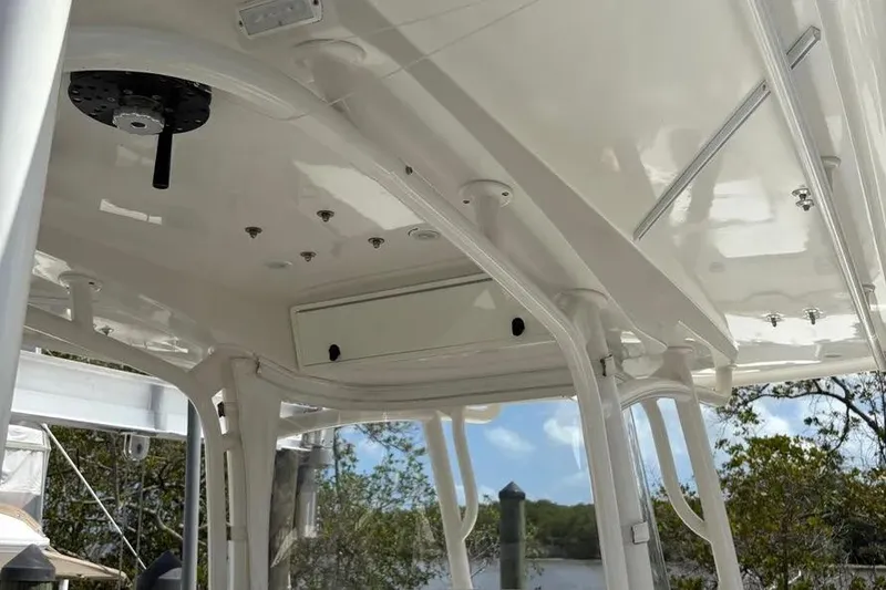 Slide: The Image of 2017 Jupiter 38 FS boat interior, showcasing sleek white ceiling and structural details. - 10