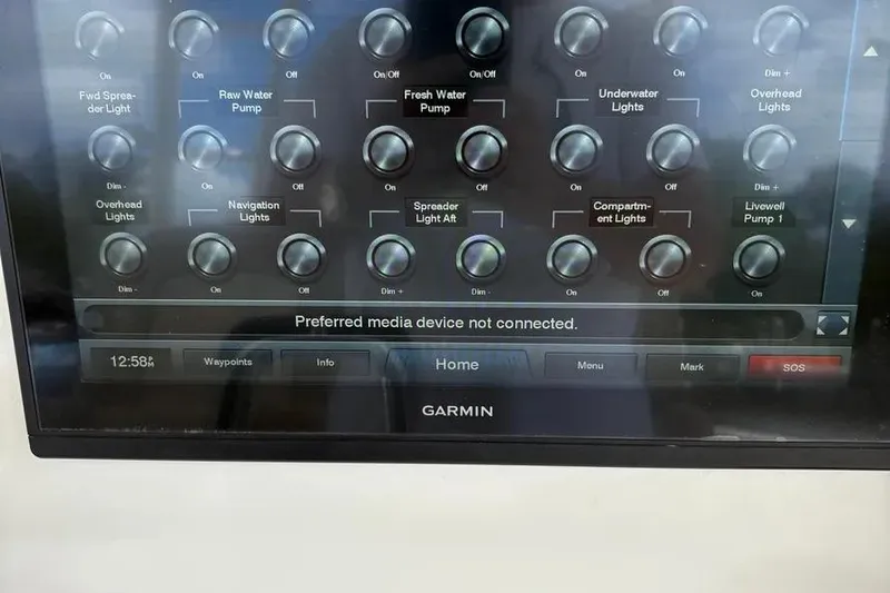 Slide: The Image of Control panel of a 2017 Jupiter 38 FS boat with Garmin interface. - 13