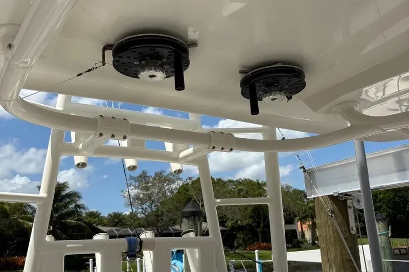 Slide: The Image of 2017 Jupiter 38 FS boat with mounted equipment under a clear blue sky. - 15