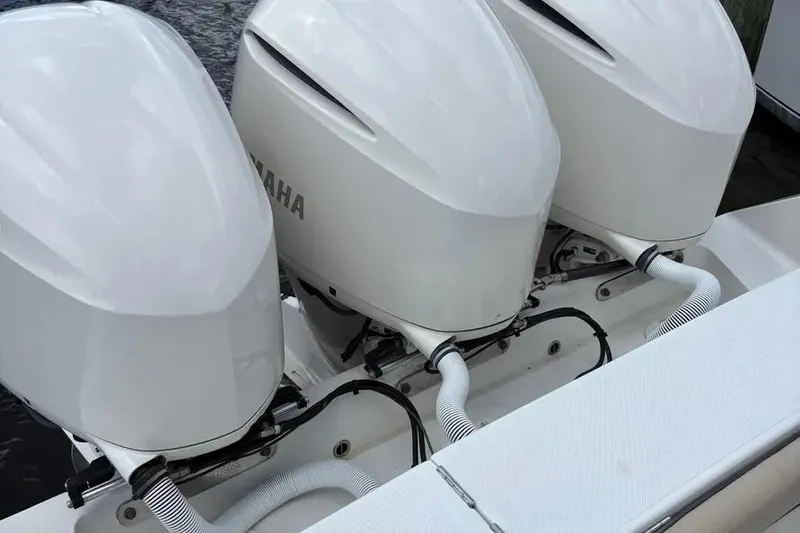 Slide: The Image of Triple Yamaha outboard engines on a 2017 Jupiter 38 FS boat. - 16