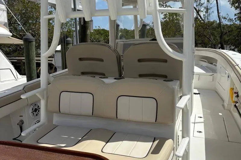 Slide: The Image of 2017 Jupiter 38 FS boat interior with beige seating and white framework. - 35